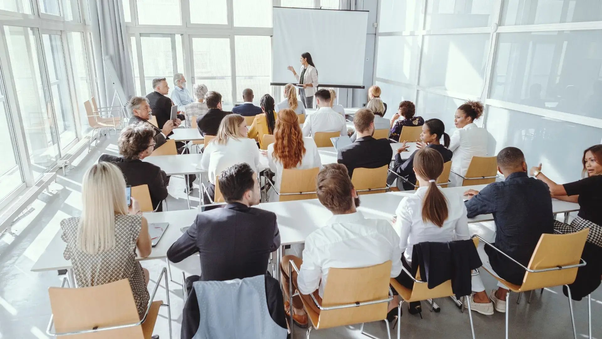 An office hall filled with attendees of a security awareness training